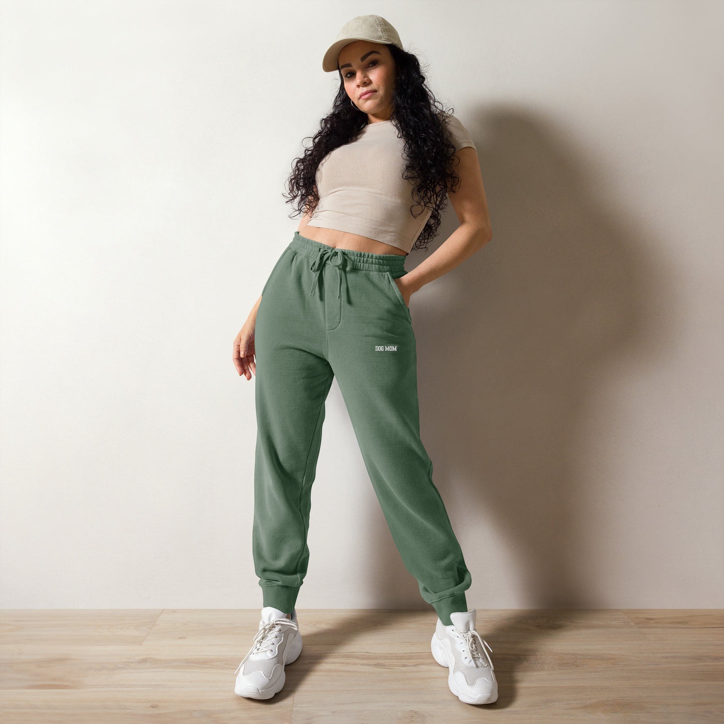 Woman wearing oversized washed out sweatpants front side color alpine green