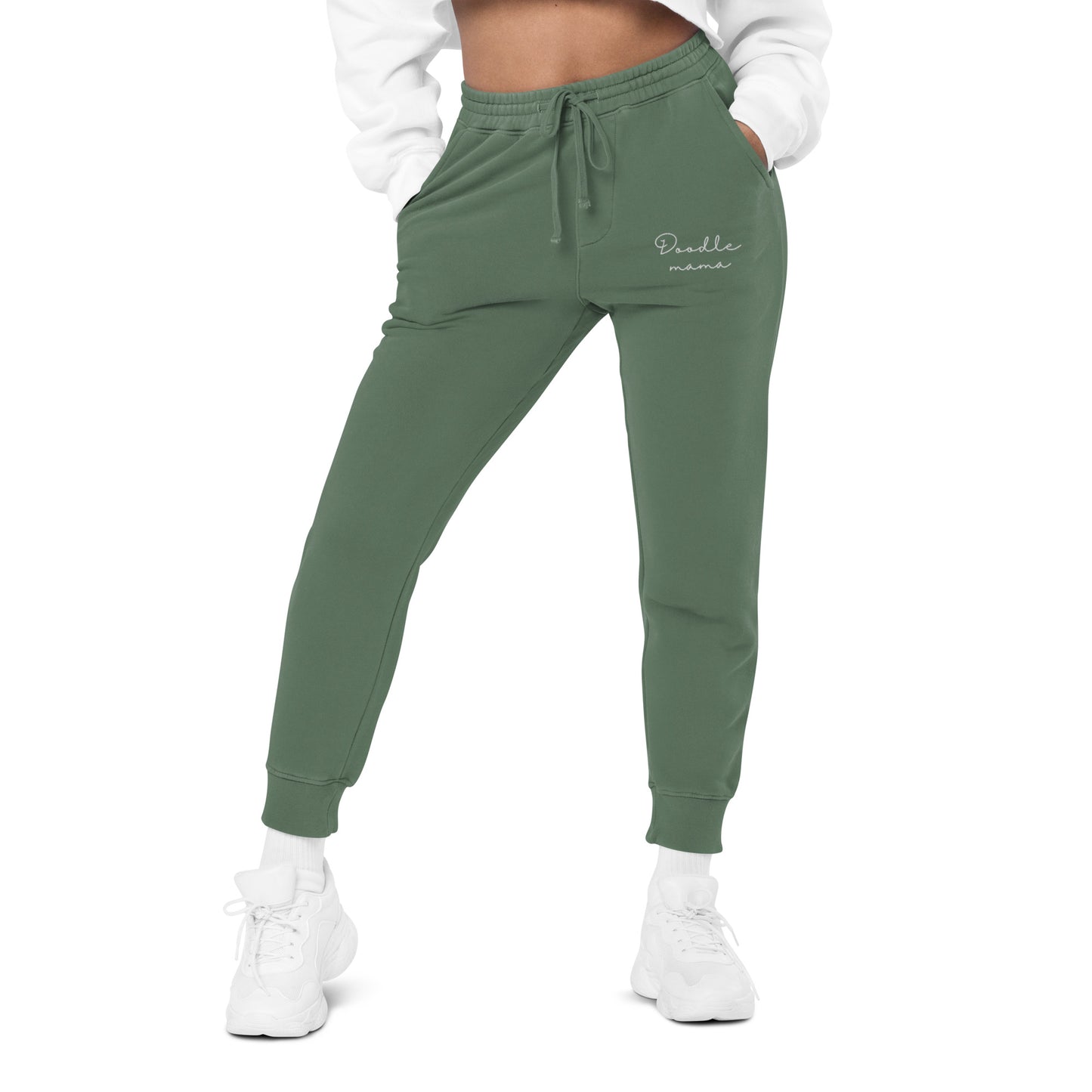 Woman wearing oversized washed out sweatpants front side color alpine green