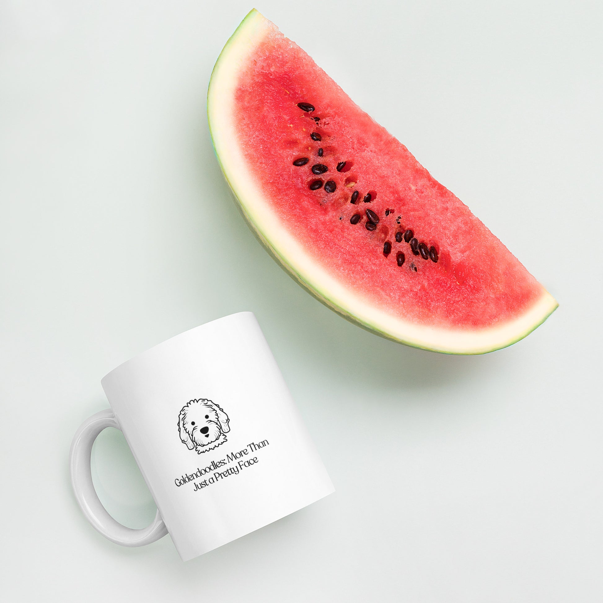 white color glossy ceramic mug that says goldendoodle more than just a pretty face with a watermelon on the side